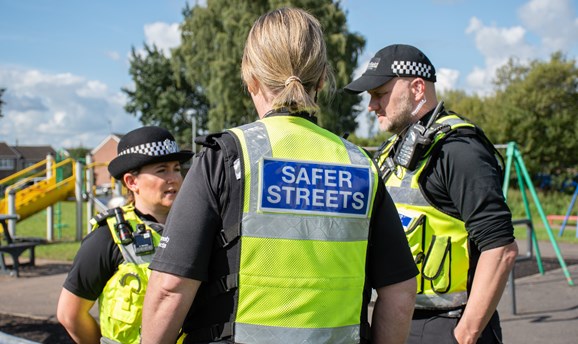 Police and community protection officers in hi-vis jackets