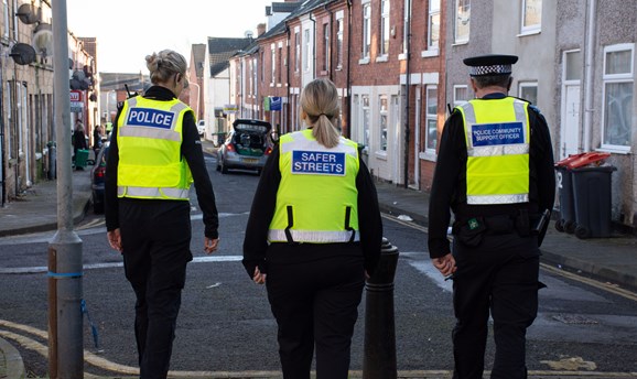A police officer, a community protection officer, and a support officer patrol Sutton 