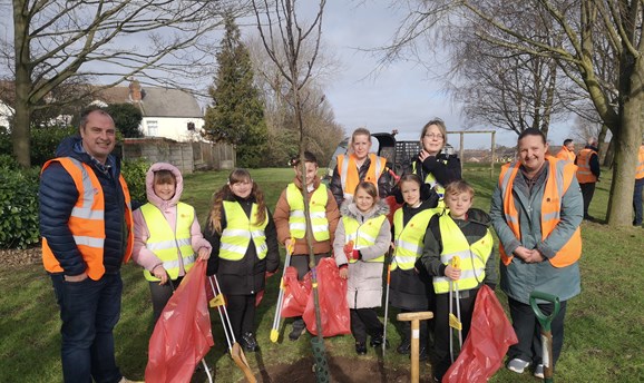 Schoolchildren and councillors plant a special tree