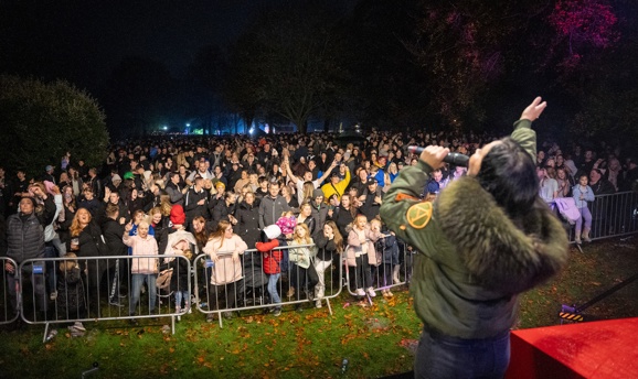 A crowd enjoying a performance at Sparks in the Park 2024