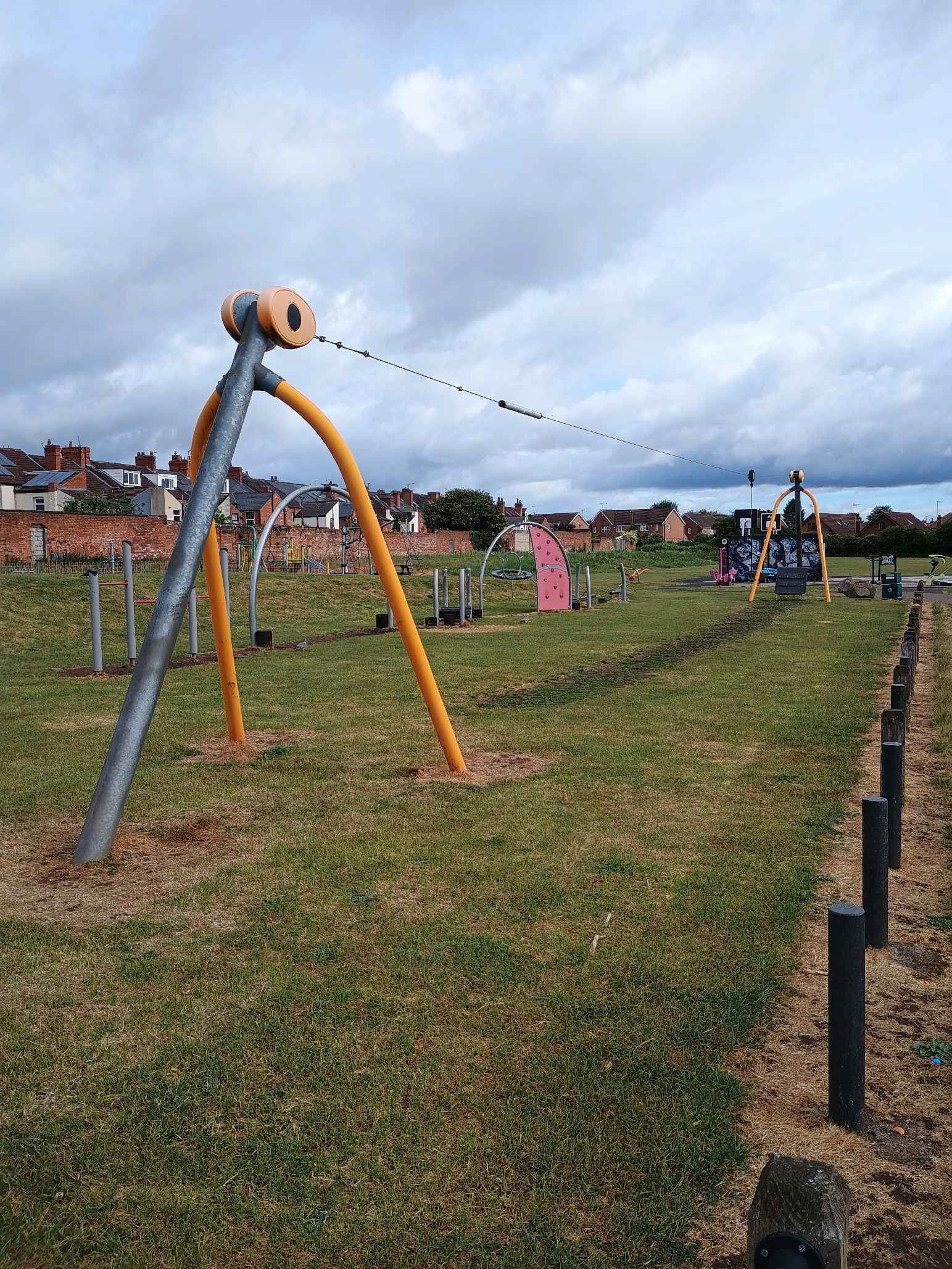 A children's play area on Albert Street Rec Ground in Hucknall, an orange cableway is pictured 