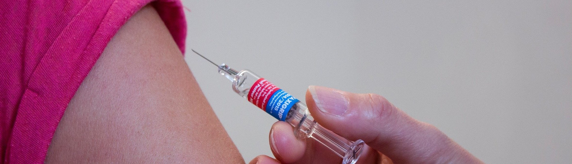 Person receiving a vaccination in their arm