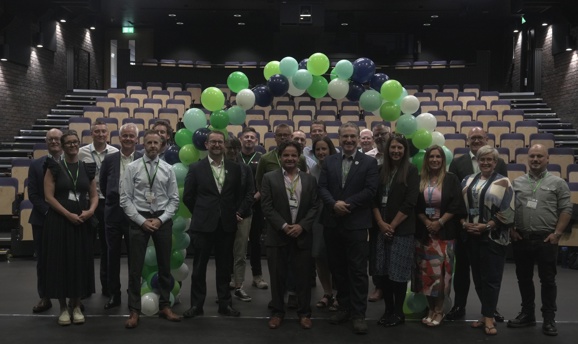 ADC colleagues with college staff inside the new Cornerstone Theatre