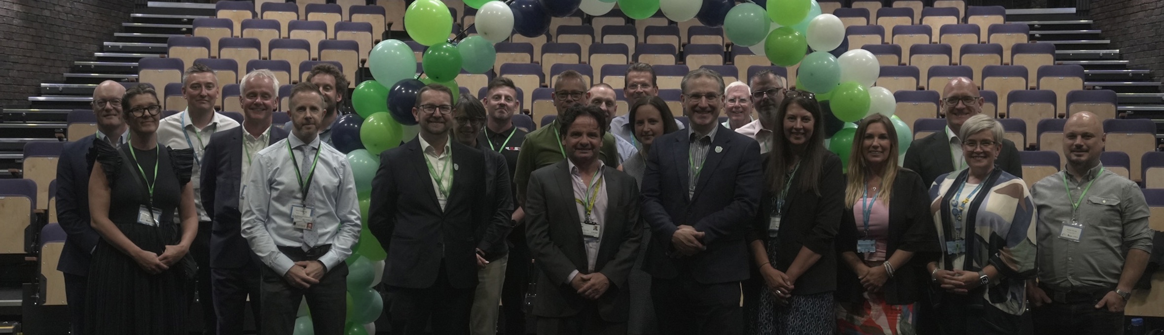 ADC colleagues with college staff inside the new Cornerstone Theatre
