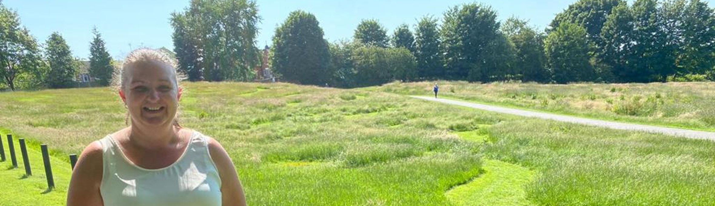 Samantha Deakin standing next to a grass maze