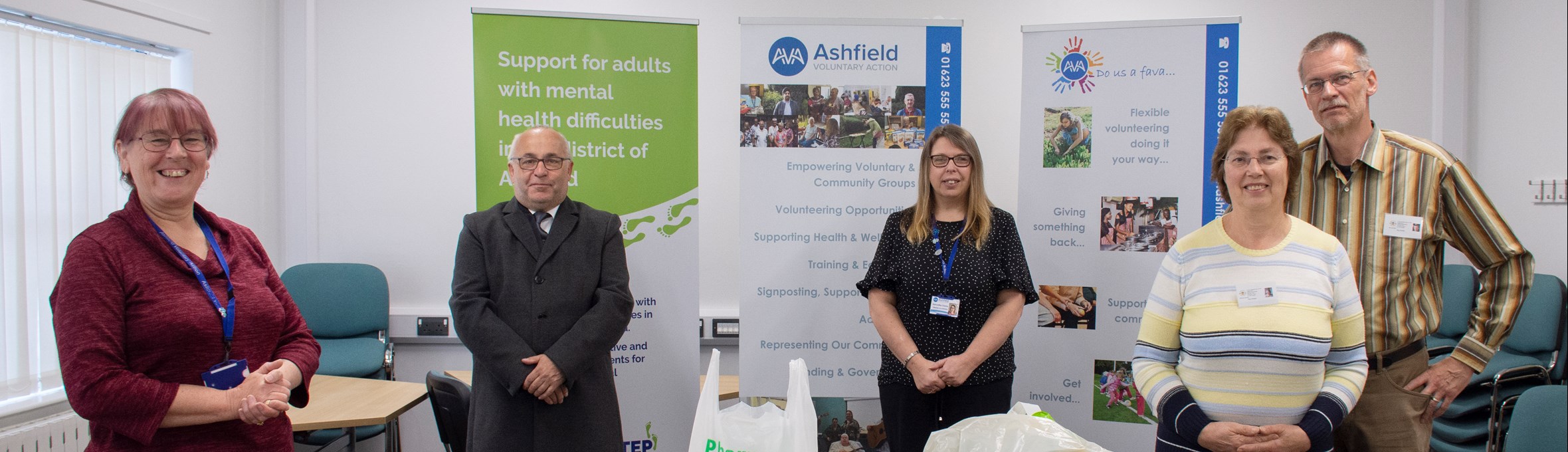 Health and wellbeing team standing in an office