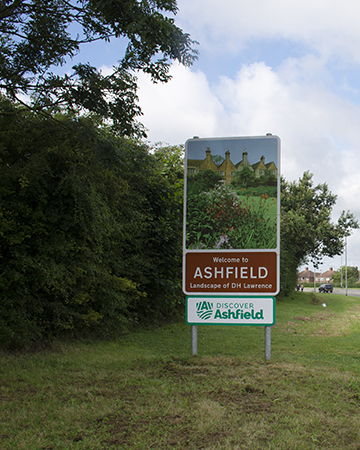 Road sign of Ashfield reads Welcome to Ashfield, Landscape of DH Lawrence, & Discover Ashfield logo