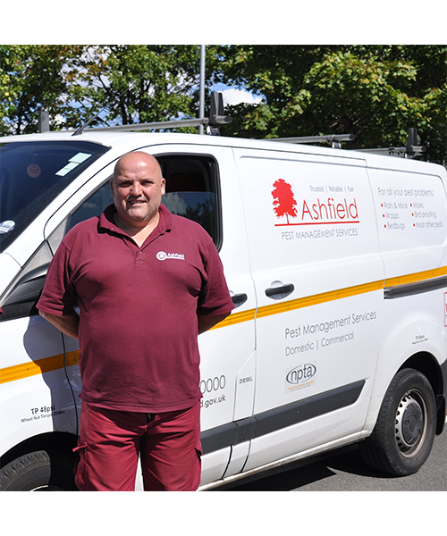 Andy Willows pest controller in Ashfield District Council uniform in front of liveried van