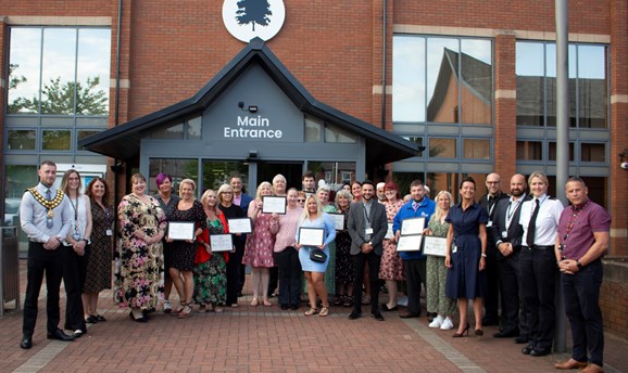 commended businesses and Council officers outside the Council building