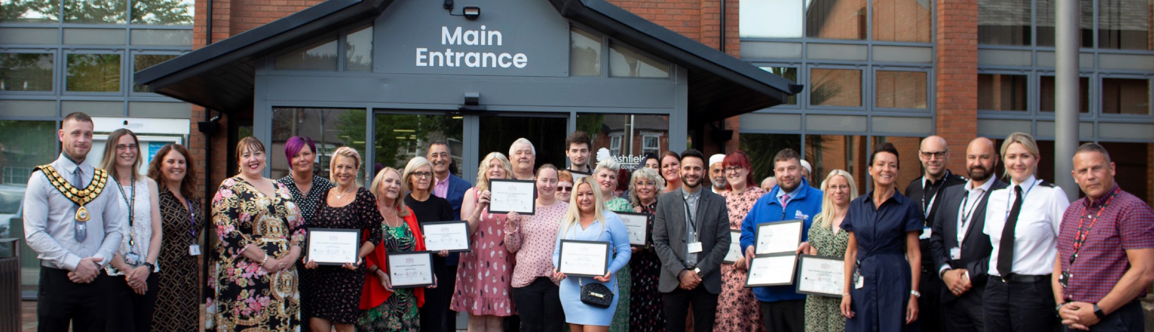 commended businesses and Council officers outside the Council building