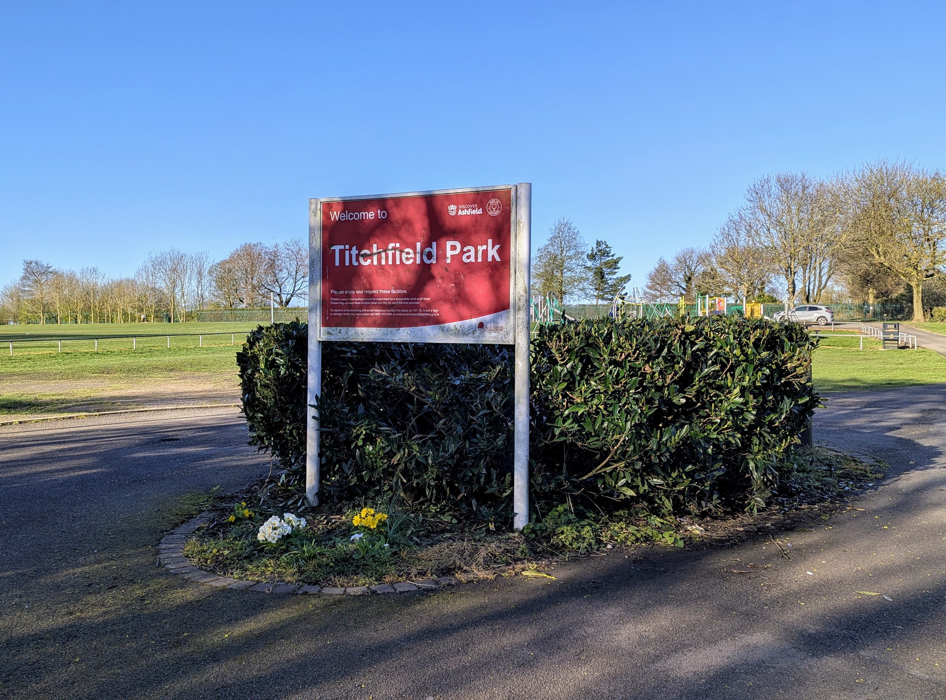 A red sign saying Welcome to Titchfield Park 