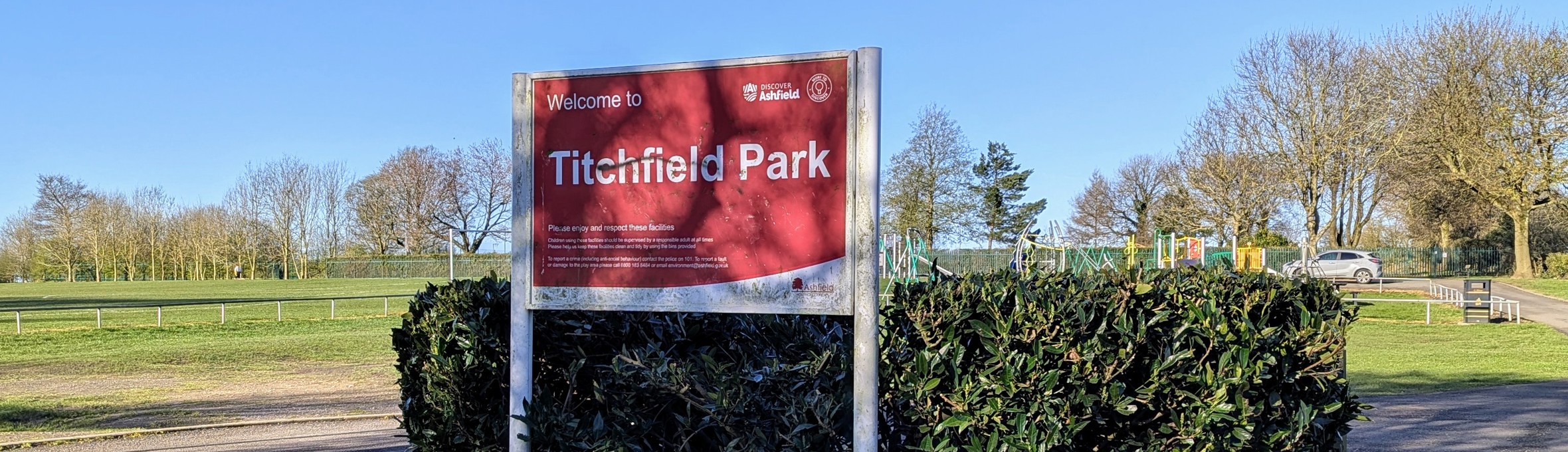 A red sign saying Welcome to Titchfield Park 