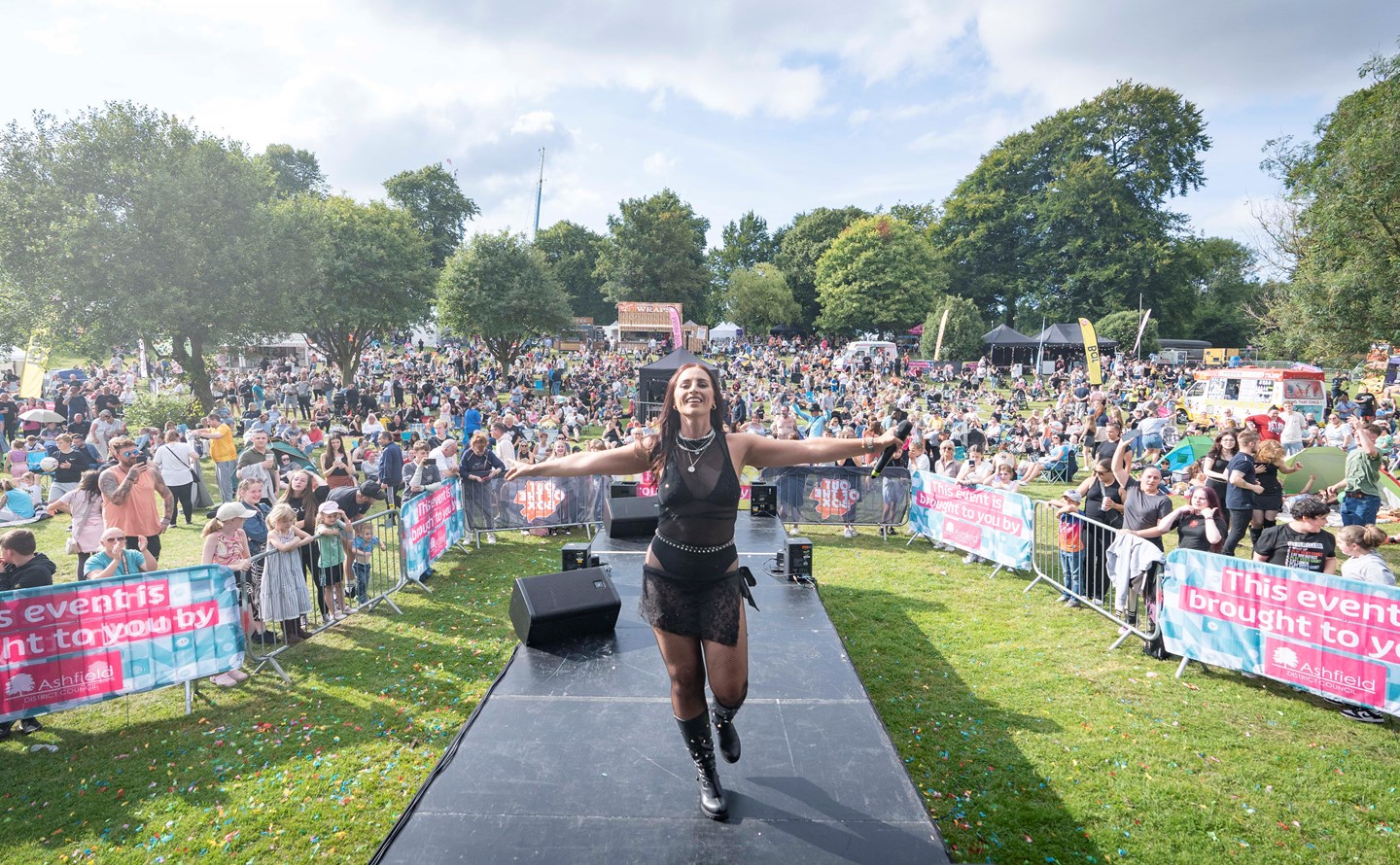 A performer on the stage surrounded by the crowds at a previous Ashfield Show