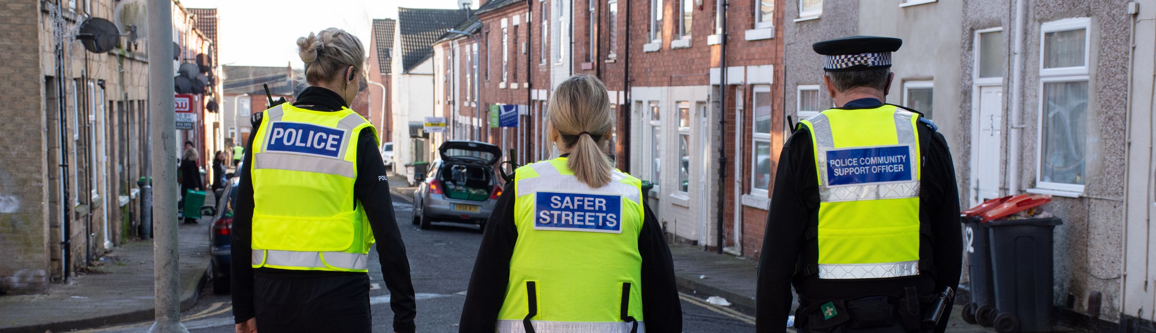 Police and community protection officers on patrol in high vis vests