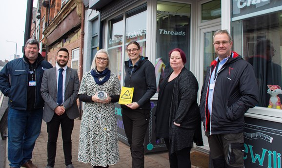 Cllr's and Ashfield Council officers with new safer streets CCTV camera outside shop