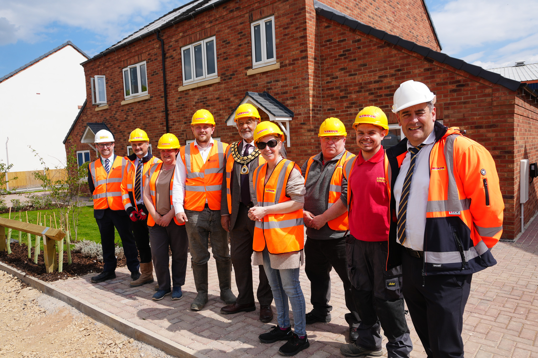 Members of the team in high vis clothing visiting Hardwick Lane, Sutton