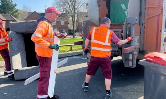 Waste Collection Team loading bulky items onto a bin lorry 