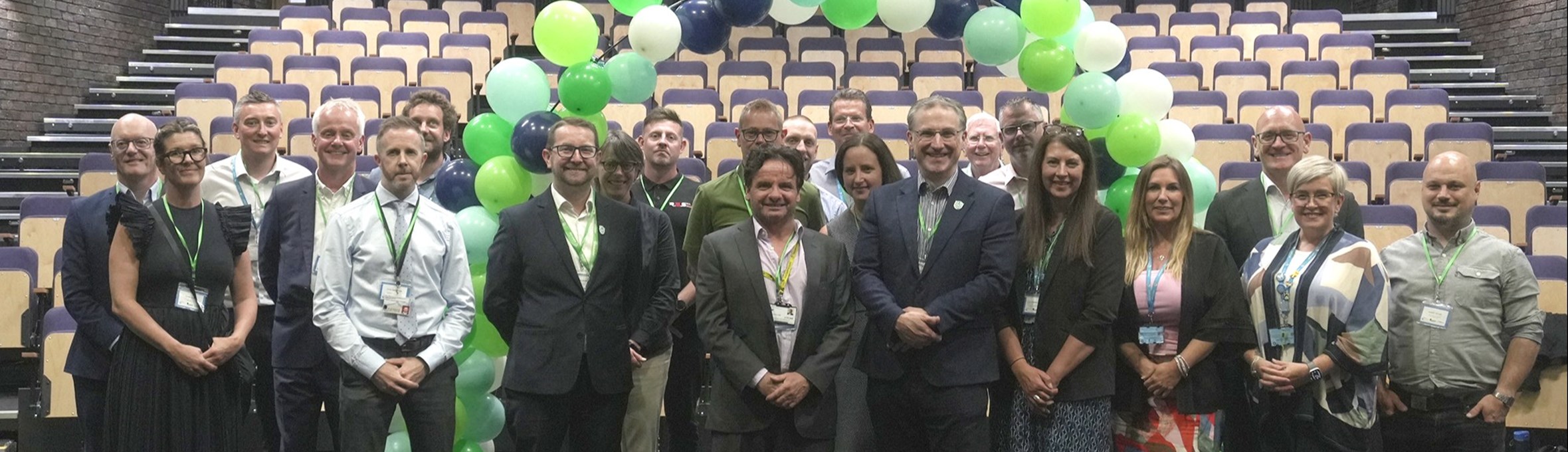 ADC colleagues with college staff inside the new Cornerstone Theatre