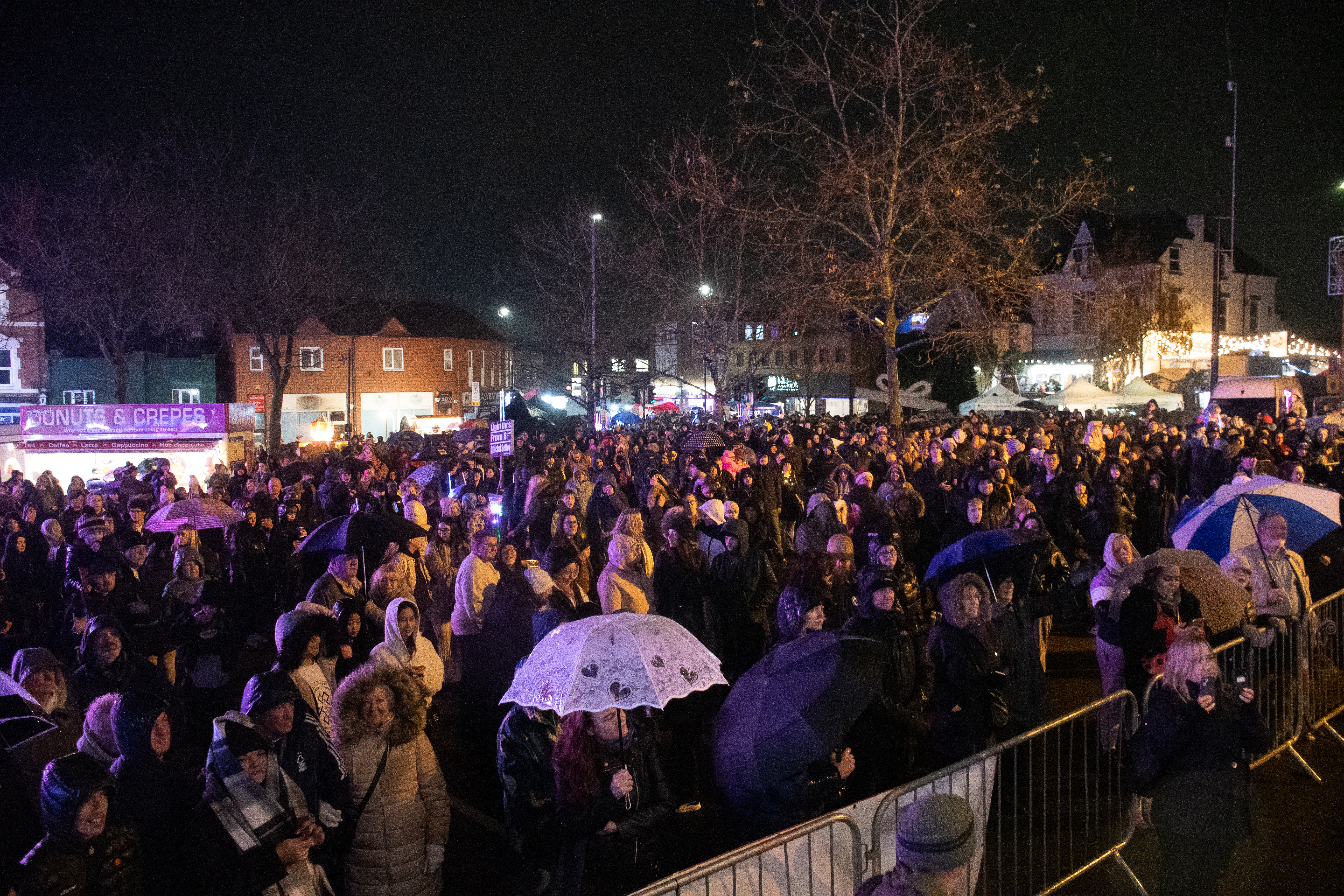 a huge crowd watches a stage on Hucknall market place 