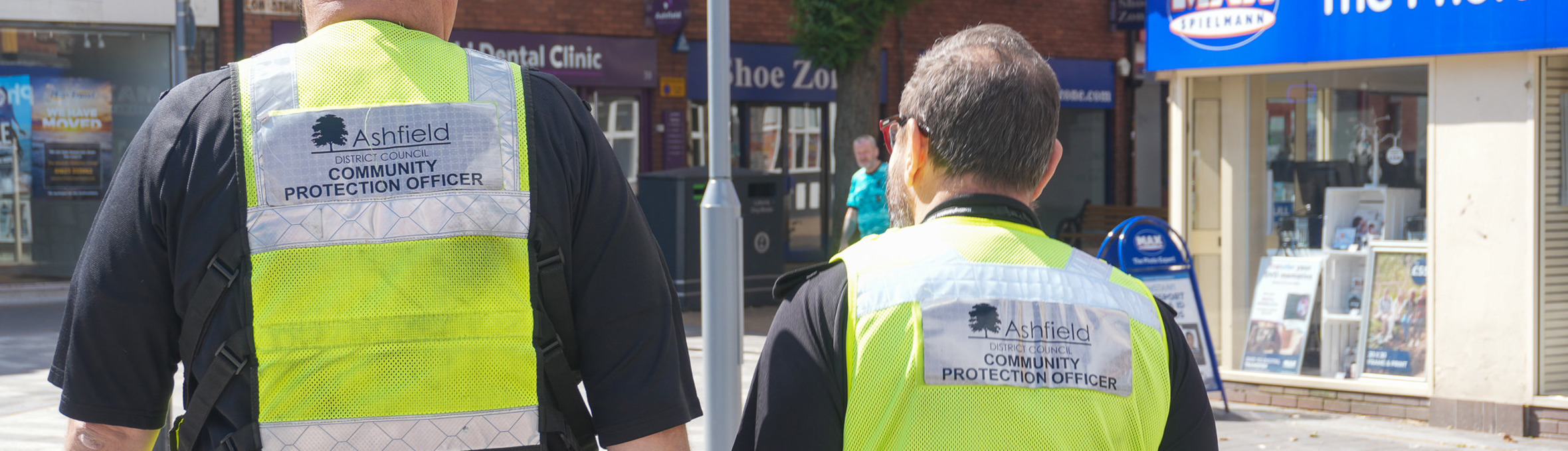 Two community protection officers in high vis vests patrol sutton