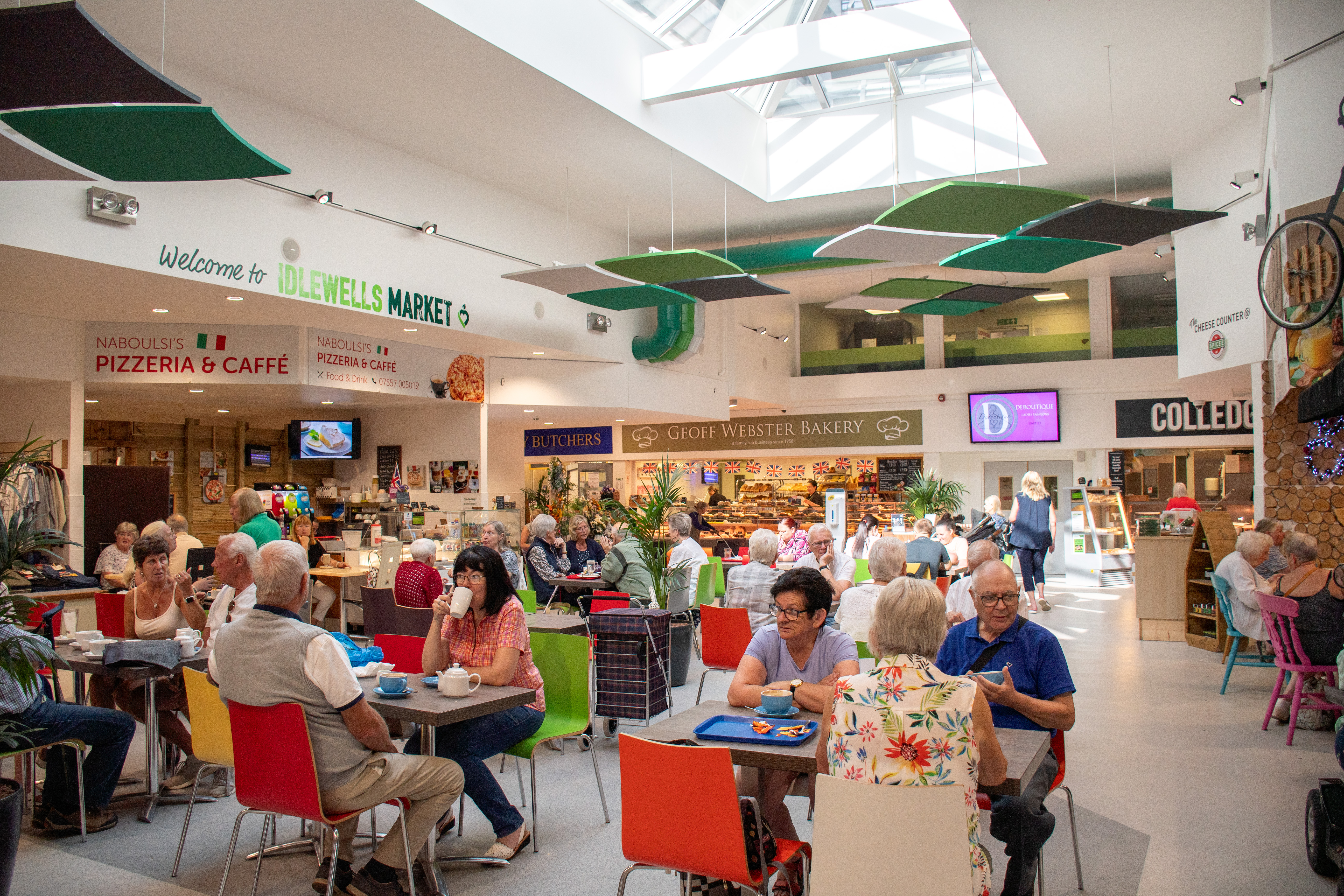 Shoppers and cafe customers at Idlewells Indoor Market