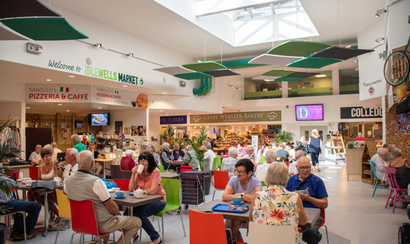 Shoppers and cafe customers at Idlewells Indoor Market