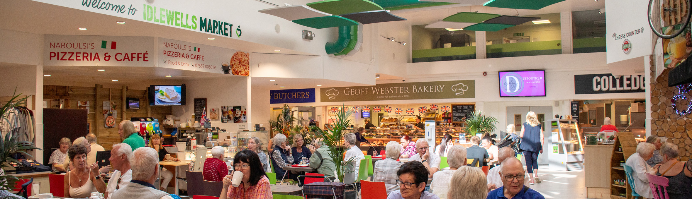 Shoppers and cafe customers at Idlewells Indoor Market