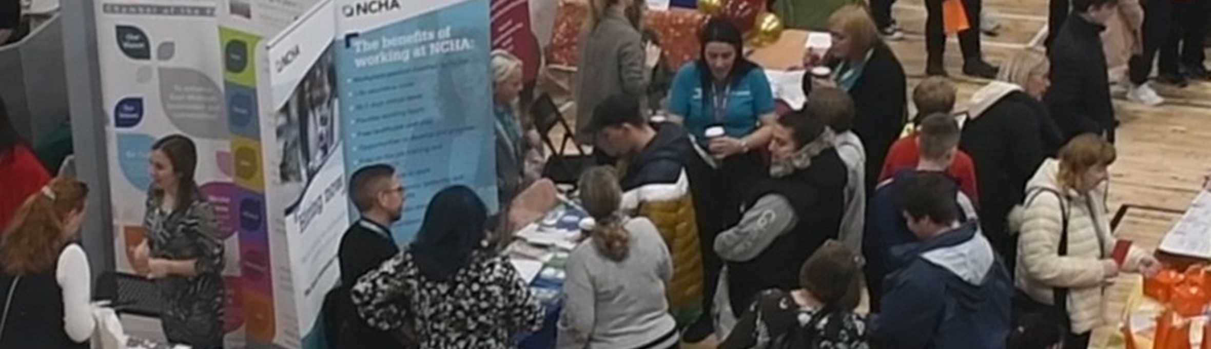 Careers Fair 2022 venue, with people visiting event stalls