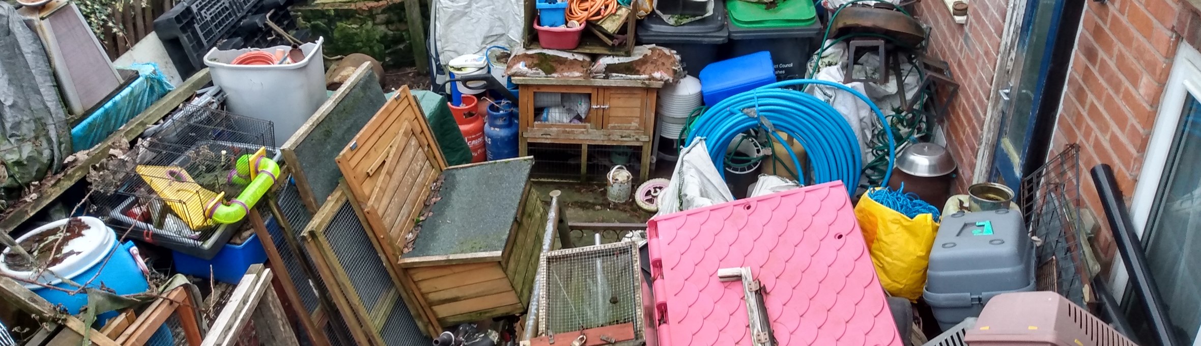 Uncleared rubbish in resident's garden