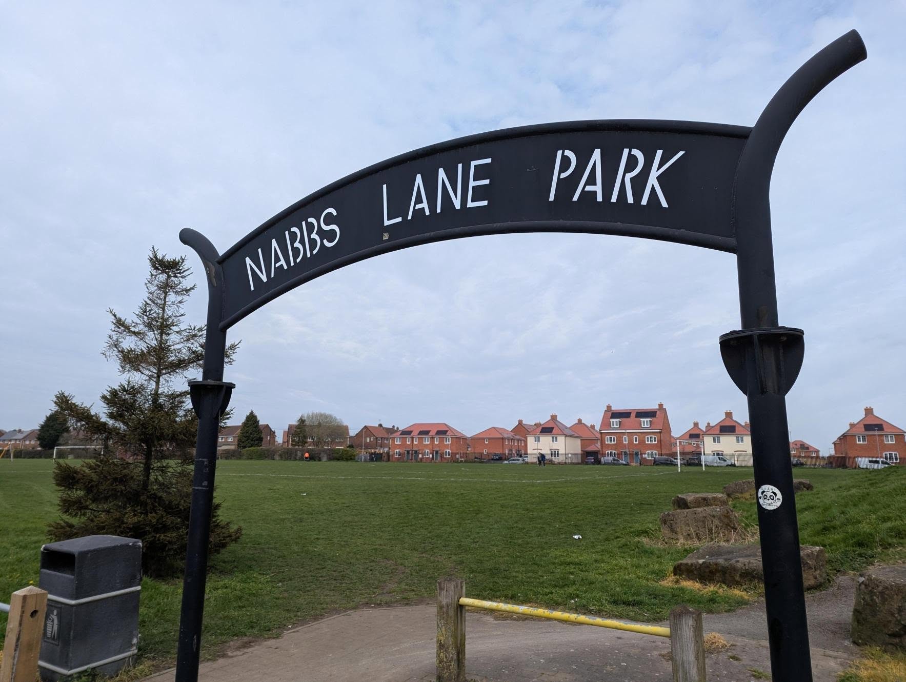 A metal sign that reads Nabbs Lane Park