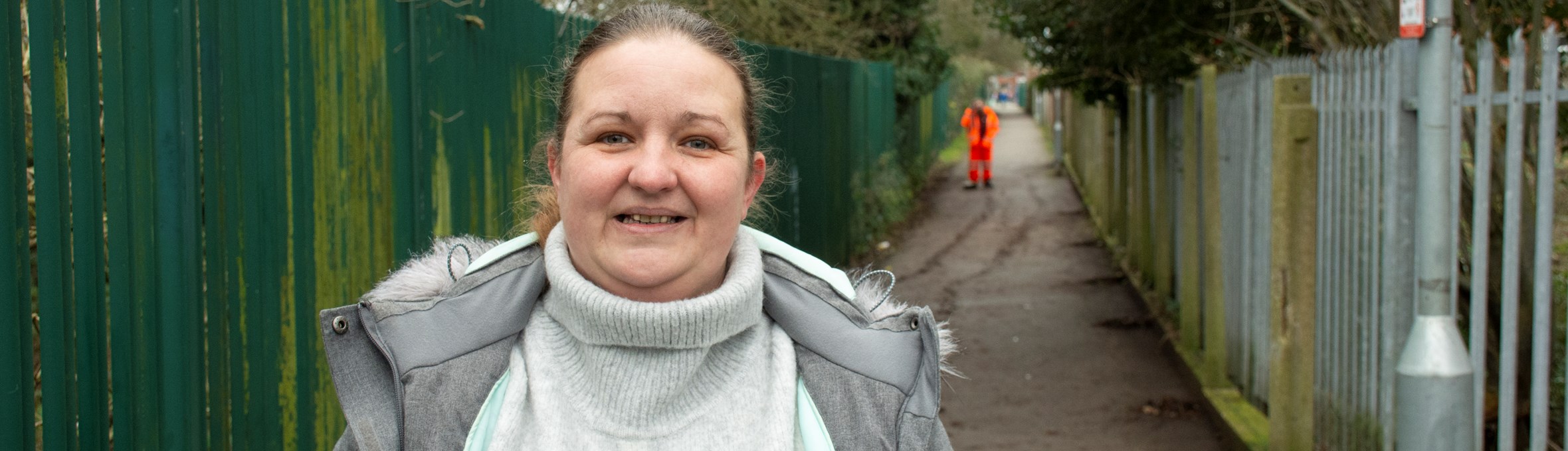 Cllr Samantha Deakin standing at the alleyway