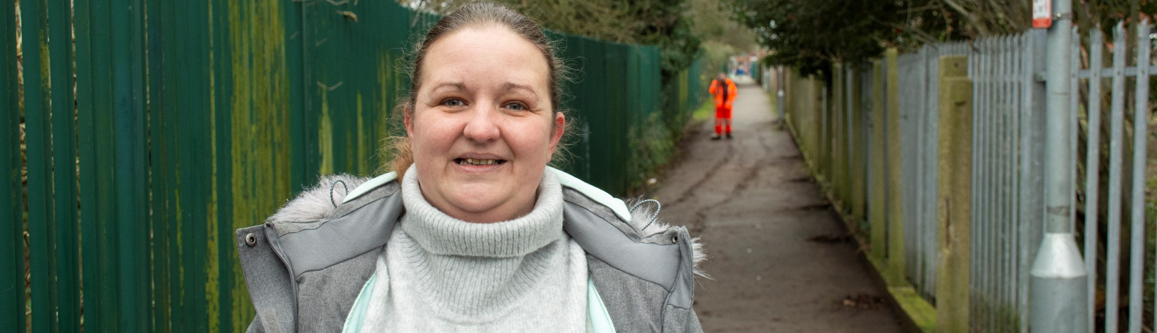 Cllr Samantha Deakin standing at the alleyway 