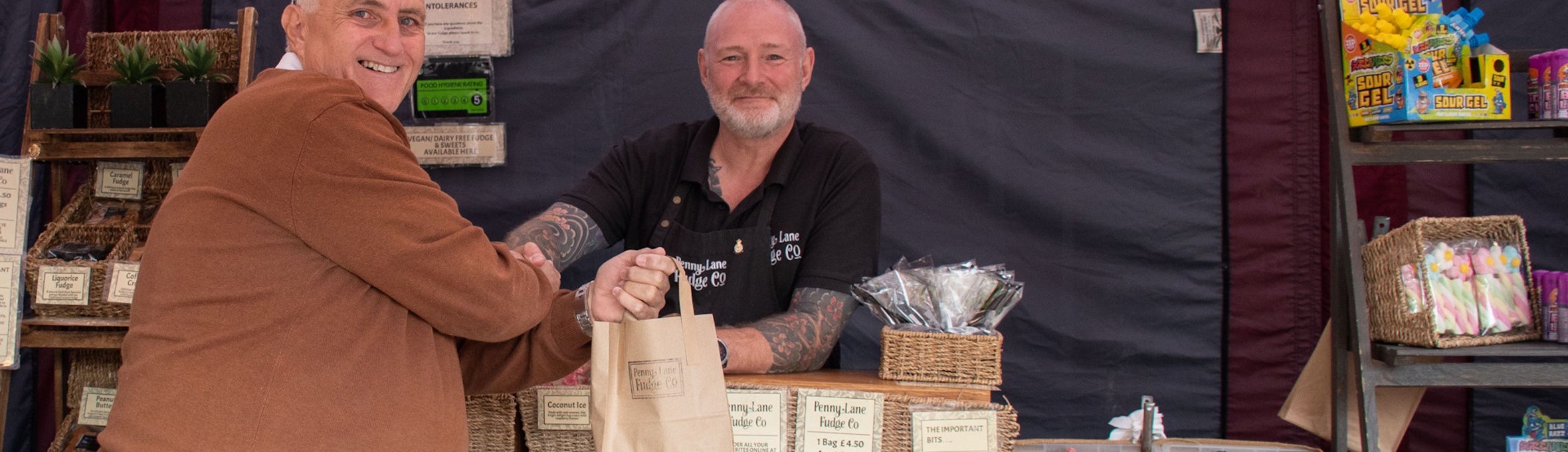 Someone making a purchase at an Ashfield Food and Drink Festival stall